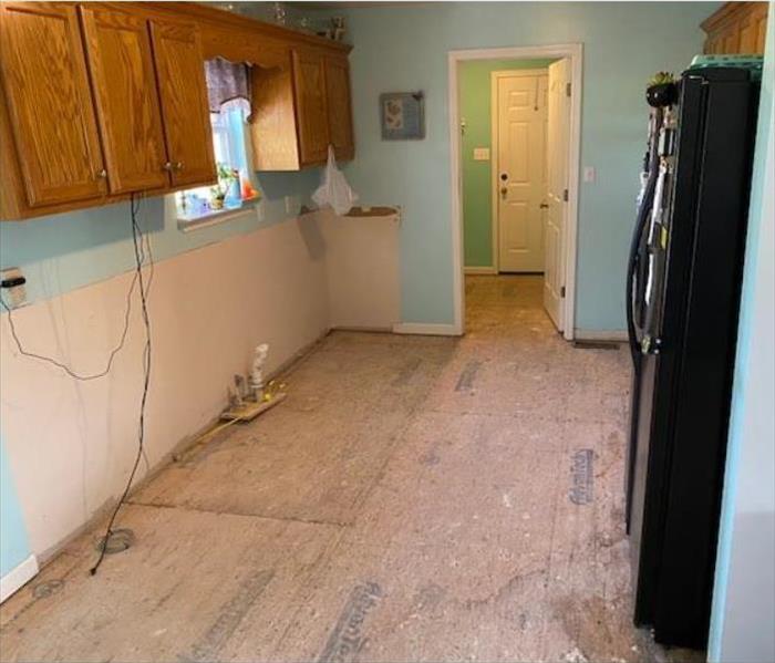 Picture is of Kitchen After water leak and flooring has been removed. 