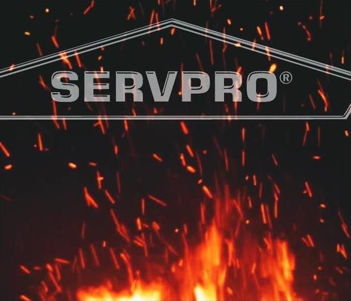 Servpro Logo with Dark Background and Orange Fire Flames Coming from Bottom
